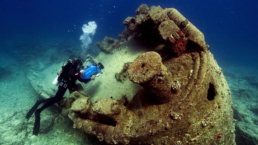 Person engaging in wreck diving exploration.